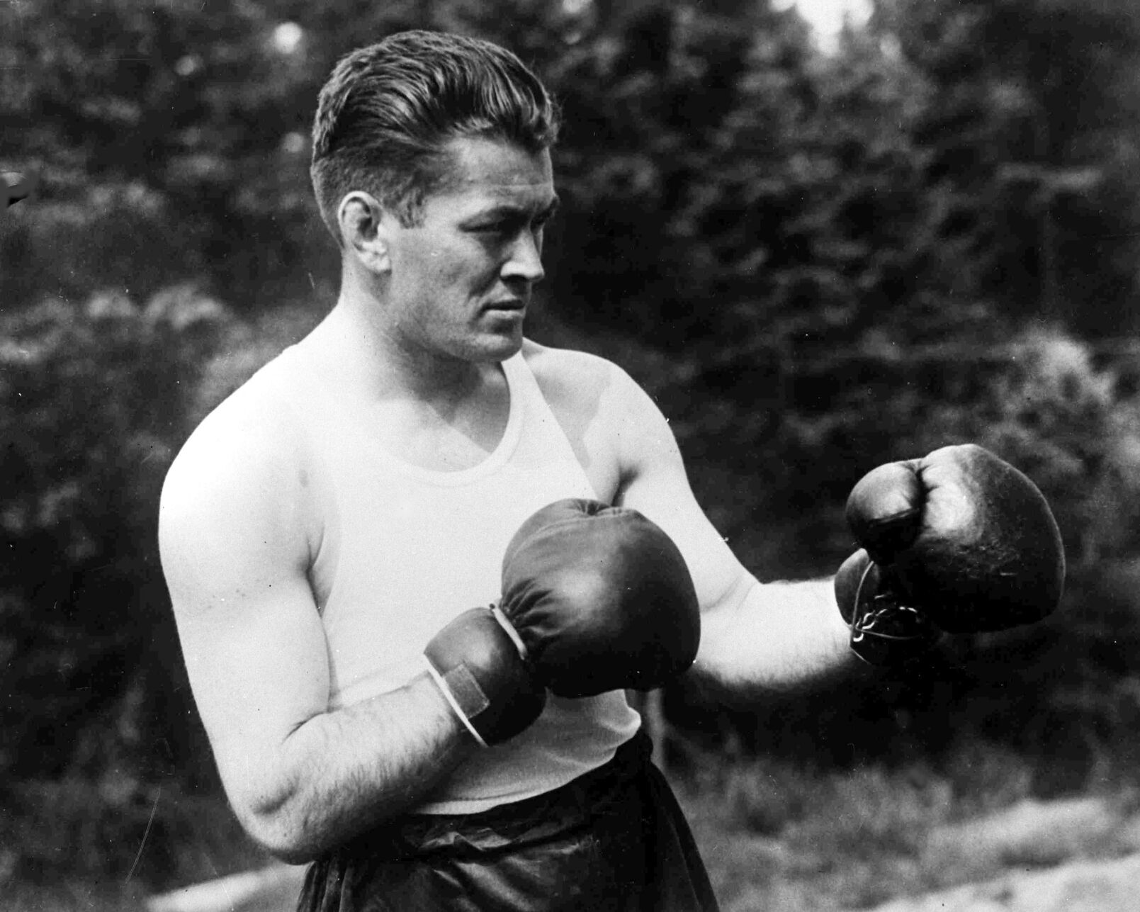 1928: Gene Tunney scores TKO at Yankee Stadium to retain heavyweight title